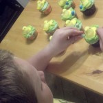 David putting 'robin eggs' on cupcakes