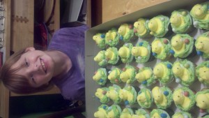 Emmie and some of the 200 cupcakes